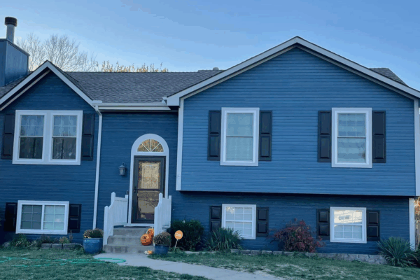 Front of Newly Painted Gray House with Dark Shutters - Our Work